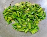 A picture of step 3 of Cauliflower (Govi) Aloo Fry with Onion Flowers.
