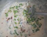 A picture of step 4 of Macaroni white sauce pasta with garlic bread.
