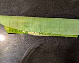 A picture of step 8 of Pabda Paturi (Pabda fish cooked in banana leaf).