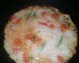 A picture of step 4 of Cheesy semolina uttapam with italian touch.