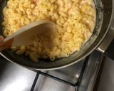 A picture of step 5 of Macaroni cheesy spicy saucy.
