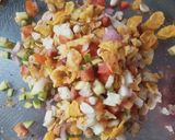 A picture of step 5 of Papad Sev Puri Chaat with Raw Mango Salsa.