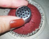 A picture of step 5 of Red Velvet çhoçolate inside Cupcakes with cream cheese frosting.
