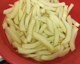 A picture of step 1 of Masala fries/ chips.