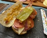 A picture of step 5 of Subway at home/ sub board.