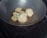 A picture of step 12 of Aloo fulcopi katla rosha ar misti doi.