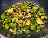 A picture of step 6 of Bhindi and Onion Fry with roasted cumin powder.