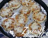 A picture of step 1 of Mini Chicken Tandoori Pizzas.