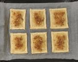 Foto del passaggio 9 della ricetta Sfogliatine con budino alla vaniglia ananas e amaretti