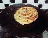 A picture of step 8 of Afghani fateer piyazi.