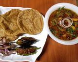 A picture of step 5 of 'Aloo sabzi & spicy puri' (potato curry & Indian fried bread).