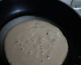 A picture of step 10 of Banana pancakes with chocolate ganache topping.