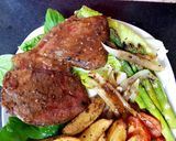 A picture of step 10 of My Peppered Marinated Steak with Onions garlic, Wedge Chips. 😘.