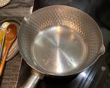 A picture of step 1 of Spinach saag.
