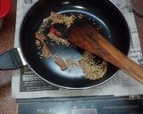 A picture of step 11 of Lemon rice and prawn curry.