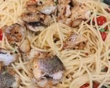 A picture of step 12 of Red snapper and tomato aglio e olio.