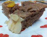 A picture of step 6 of Chocolate cake covered with custard.