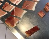 A picture of step 4 of Appetizer Skewers with Green Olives, Tomato, Prosciutto, and Pyrenees Cheese.