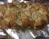 A picture of step 4 of Pull apart garlic cheesy bread.