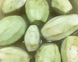 A picture of step 1 of Alu baigan.