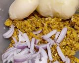 A picture of step 2 of Corn fritters in appe pan.