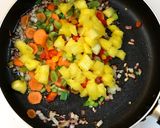 A picture of step 4 of Thai Pineapple Fried Rice.