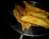 A picture of step 4 of Chatpatay crispy potato wedges.