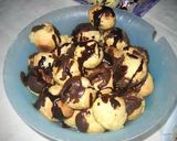 Foto del paso 7 de la receta: Bombas de crema con hilos de caramelo