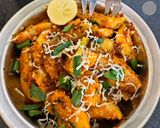 A picture of step 3 of Masala potato garnish with onion flower stalk.