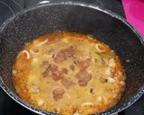 A picture of step 4 of Squid with Onions.