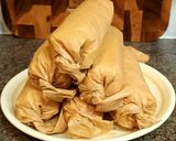 A picture of step 7 of Snack rolls from toasted bread.