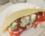 A picture of step 4 of Pita bread packet vegetable sandwich.