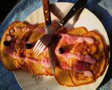 A picture of step 6 of Soufflé pancakes topped with blueberry cream.