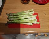 A picture of step 2 of Asparagus with burrata in the oven.