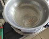 A picture of step 1 of Potato - Brinjal Curry.