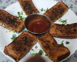 A picture of step 7 of Garlic Brown Bread with peri peri masala Dominos style sticks.