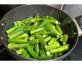 A picture of step 1 of Dry bhindi aloo sabzi without onion and ginger garlic.