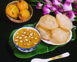 A picture of step 10 of Mango Kheer and Puri.