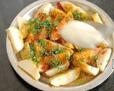 A picture of step 1 of Masala potato garnish with onion flower stalk.