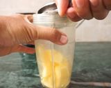 A picture of step 1 of Mango & lemon punch.