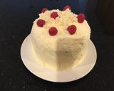 A picture of step 14 of Vanilla Layer Cake filled withLenon and Rasberry and frosted with Fresh Lemon Cream.