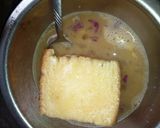 A picture of step 2 of Bread in egg.