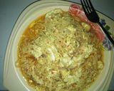 A picture of step 4 of Jollof din indomie da kwai.