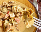 Foto del paso 4 de la receta: Alcachofas con champiñones y jamón