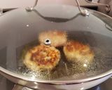 A picture of step 9 of Bring-a-smile chicken burgers with blue cheese or pesto filling 😊.