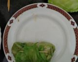 A picture of step 11 of Nutty lemony cabbage roll in green sauce.
