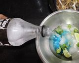 A picture of step 4 of Refreshing blue lagoon mocktail.