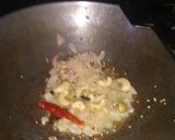 A picture of step 1 of Cauliflower curry with white gravy.