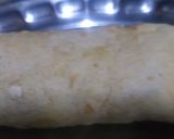 A picture of step 6 of Tortilla wrap filled grilled cheesy white sauce.