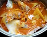 A picture of step 6 of Southern Thai Sour Curry with Salmon Head and Pickled Bamboo Shoots.